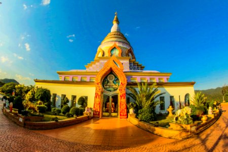 White Buddhist Temple With Blue Cloudy Background