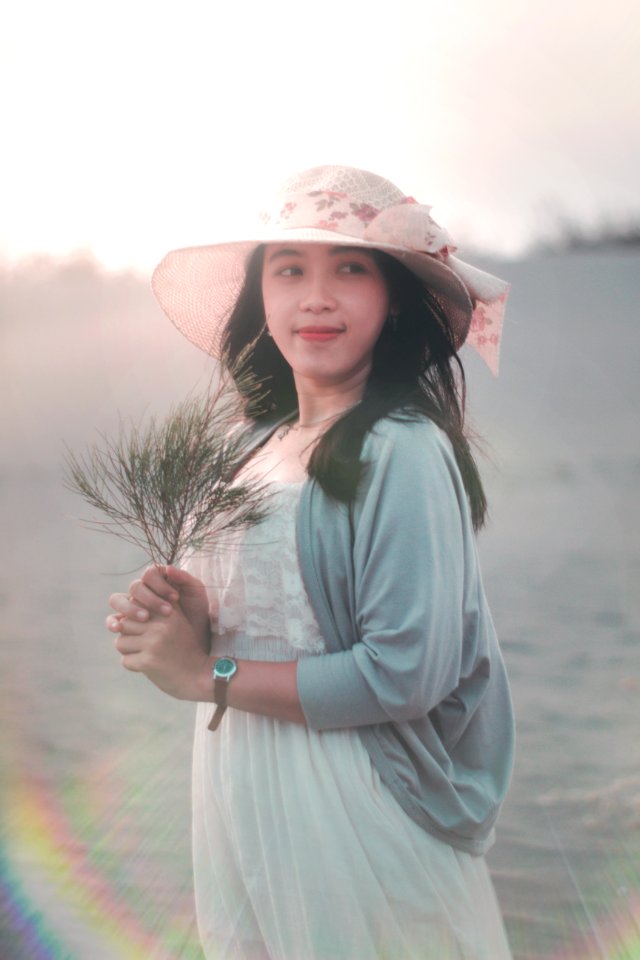 Woman Holding Brown Twig