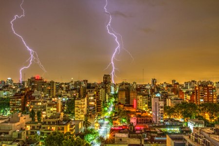 Photography Of Thunder Strike Behind City photo