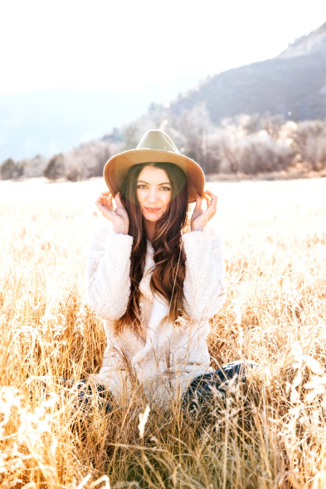 Photography Of Woman On Brown Field