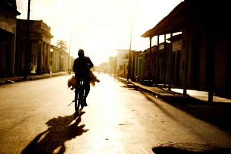 Person Riding On Bike Photo Shot During Daylight photo