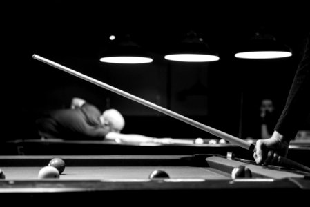 Grayscale Photo Of Man Holding Cue-stick photo