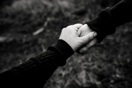 Black And White Photo Of Holding Hands photo