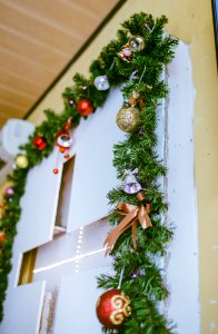 Photo Of Green Garland With Bold Bauble Decor
