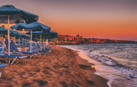 House And Parasols Near Beach photo