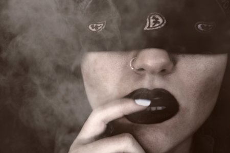 Blindfolded Woman With Finger On Lips Grayscale Portrait photo