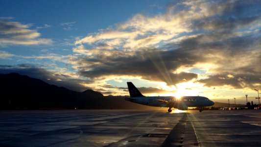 Silhouette Of Airplane In Golden Hour