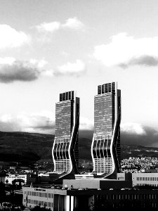 Greyscale Photography Of Two High Rise Buildings photo