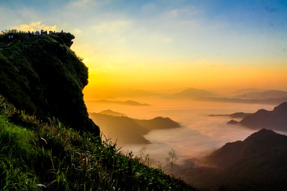 Landscape Photography Of Cliff With Sea Of Clouds During Golden Hour