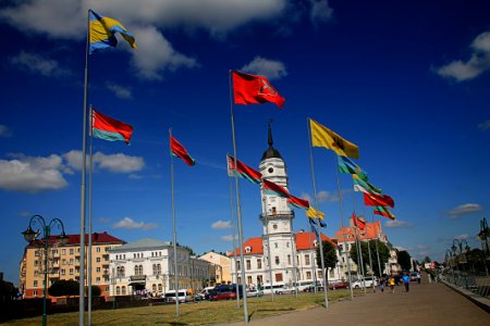 Different Flags Waving On Poles At Daytime photo