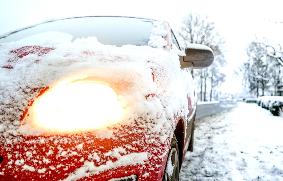 Snow Covered Red Sedan
