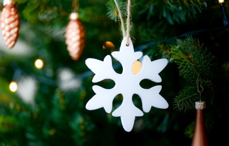 White Snow Flake Hanging On Christmas Tree