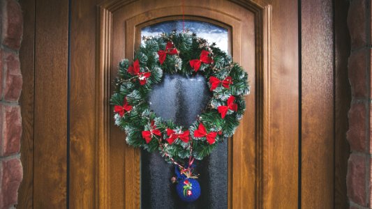 Green And Red Christmas Wreath On Door photo