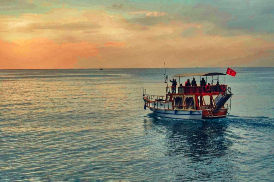 Brown And White Boat In The Middle Of Ocean At Daytime