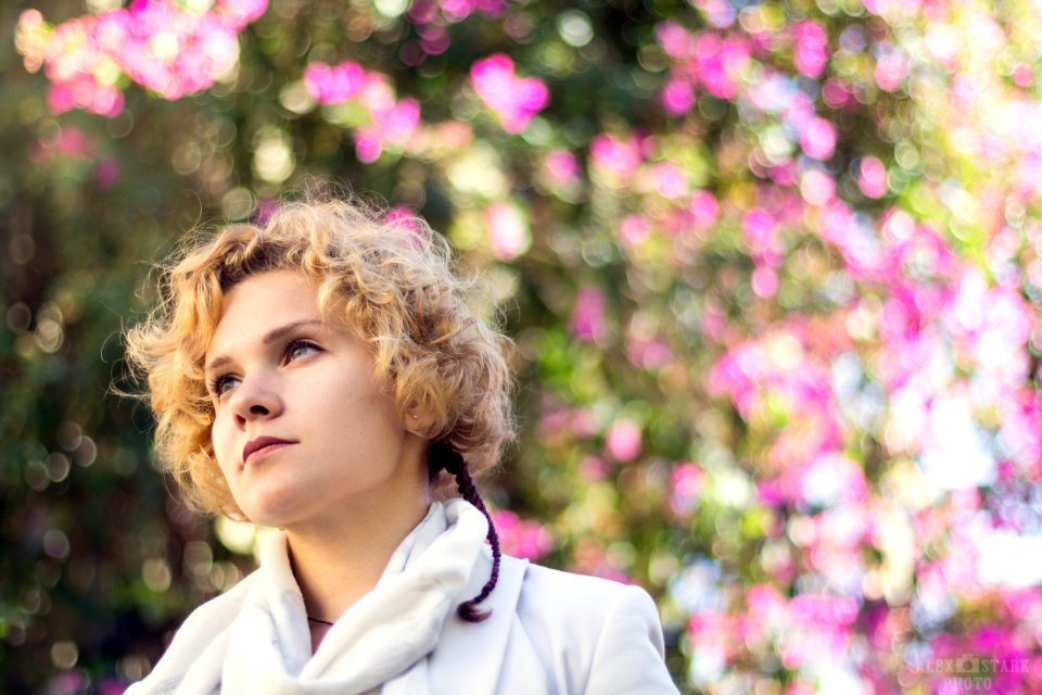 Photo Of A Woman Wearing White Coat