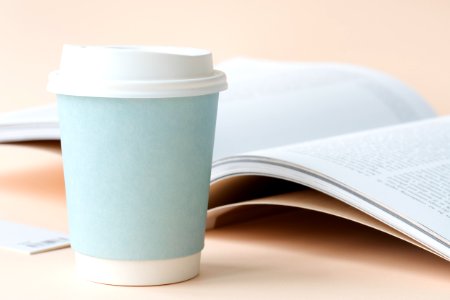 Photo Of Coffee Cup Beside Book photo