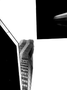 Grayscale Photo Of Glass Curtain High Rise Building photo