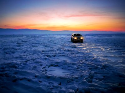 Black Suv On Snow During Golden Hour