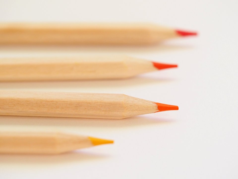 Tilt Shift Lens Photography Of Orange Coloring Tool