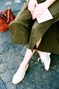 Person Wearing Green Skirt And Pair Of White Low Top Sneakers photo