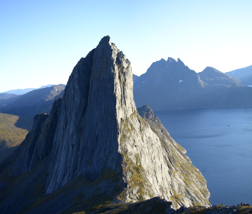 Grey Rock Formation Near Body Of Water At Daytime