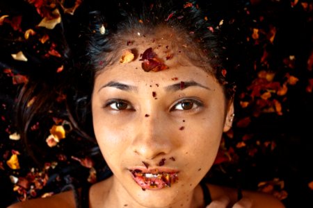 Photography Of Woman Whose Lying On Dried Leaves photo