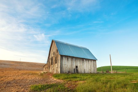 Photo Of Beige And Gray Wooden Barn House On Green Grass photo