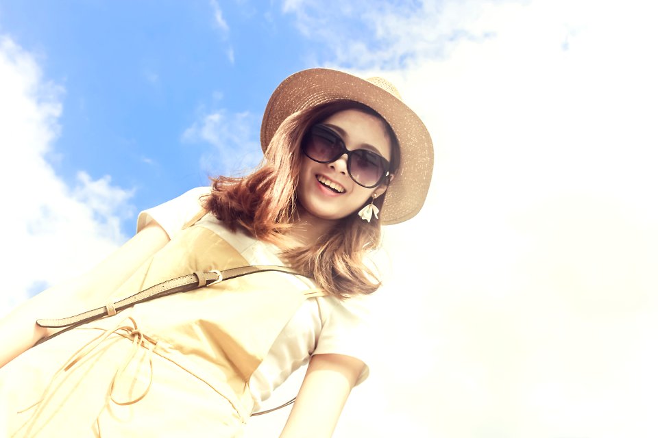 Woman Wearing Dress Smiling Taking For Picture Under Cloudy Skies