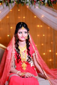 Woman In Pink And Beige Floral Traditional Dress
