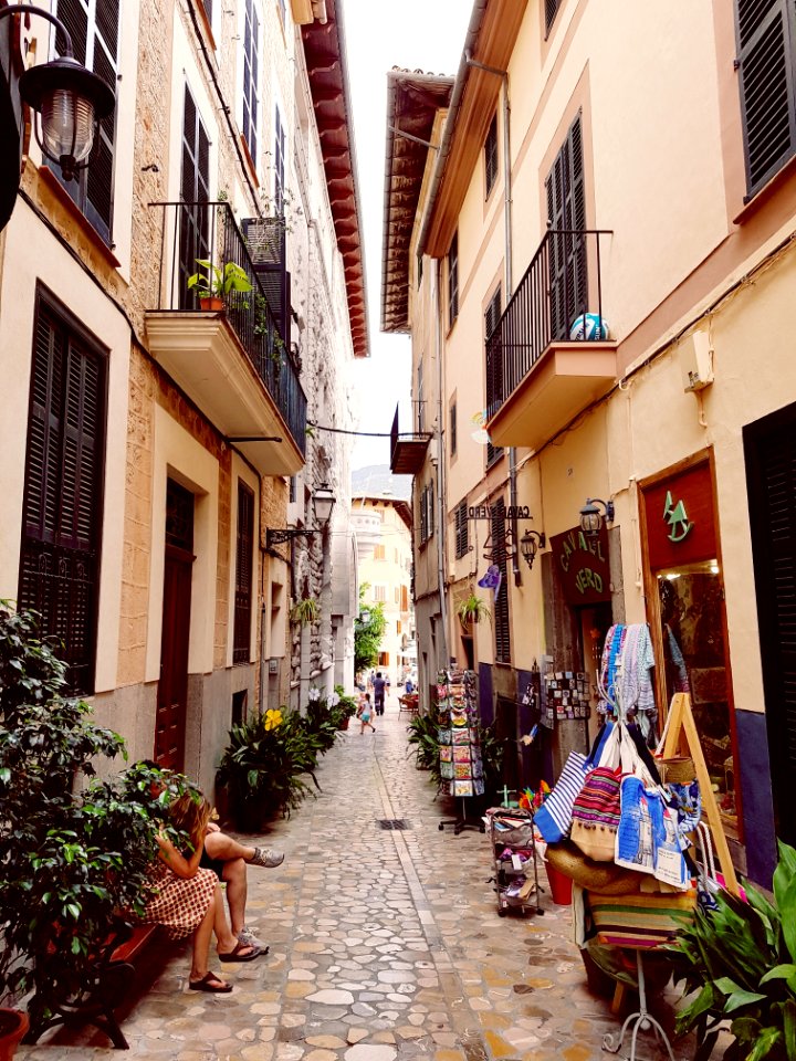 Photo Of Concrete Buildings With Little Stores In Between Buildings