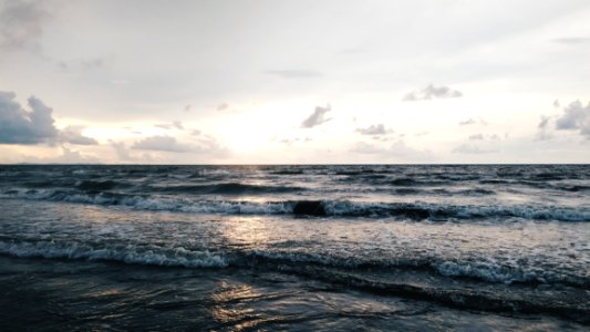 Sea Waves On White And Gray Sky At Daytime photo