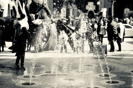 Black And White Photo Of Fountain And People photo