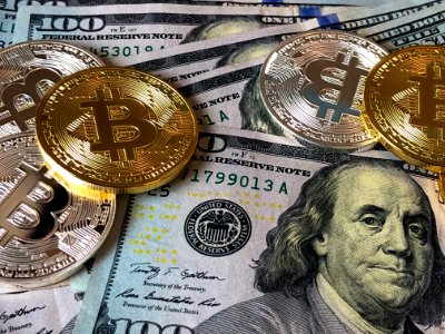 Bitcoins And Us Dollar Bills