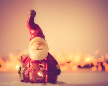 Shallow Focus Photography Of Santa Claus Figurine photo
