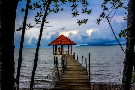 Person Standing On Boardwalk photo