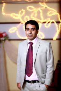 Man In Grey And Pink Suit