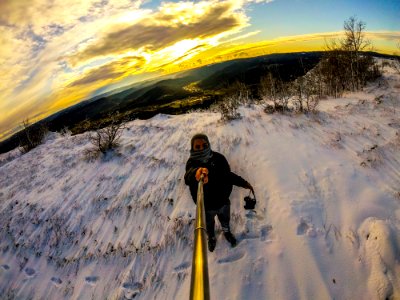 Man Standing On Snowy Terrain