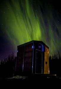 Photo Of Wooden Shed Under Northern Lights photo
