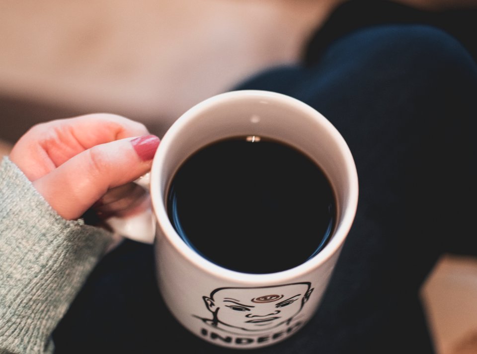Black Beverage In White And Black Ceramic Mug