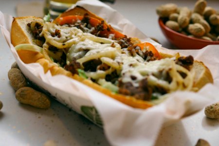 Bread With Meat And Salad Dressing On White Paper Towel On Top Of Box Closeup Photography