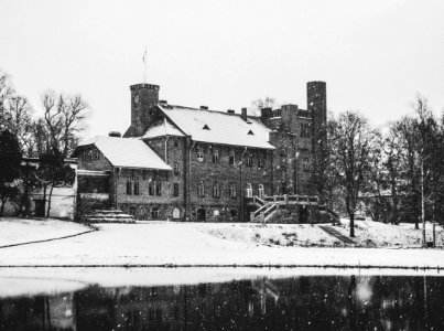 Greyscale Photo Of Concrete House Covered With Snow photo
