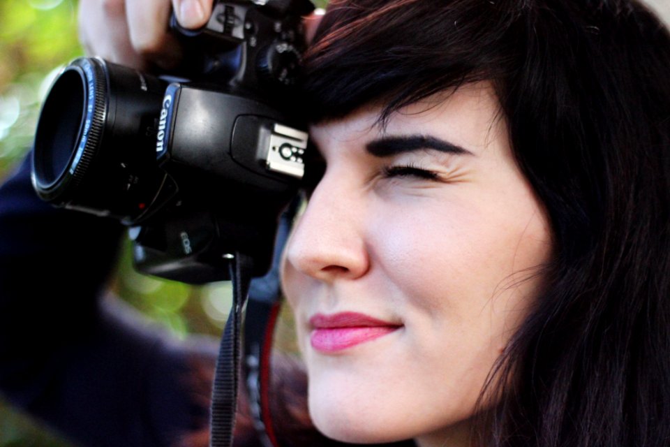 Woman Taking A Photo With Canon Dslr Camera