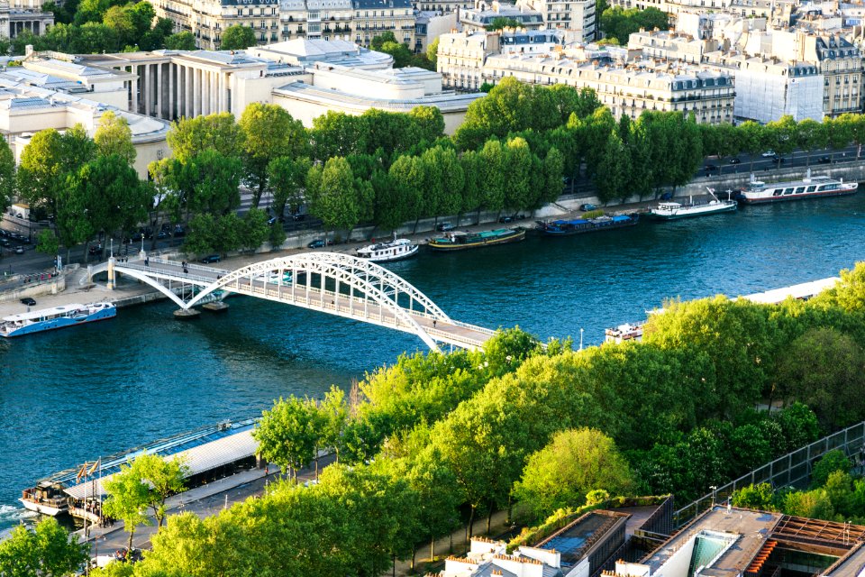 White Steel Bridge On Water Canal In The Middle Of City During Day