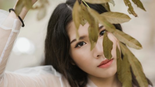 Woman Wearing Illusion Long-sleeved Shirt Under Green Leaf