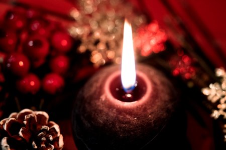 Lighted Black Round Candle photo