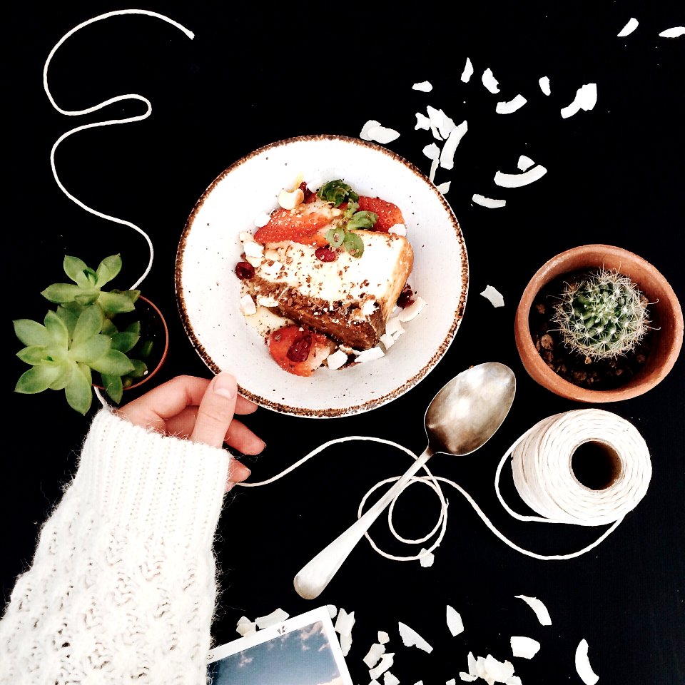 Woman Touching White And Brown Ceramic Saucer With Strawberry Cake