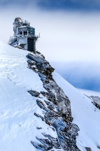 Photo Of A Building In A Snowy Hill