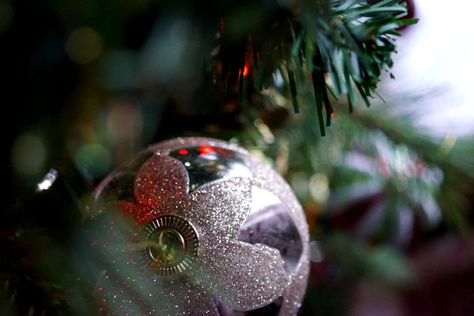 Silver Christmas Bauble Hanging On Christmas Tree