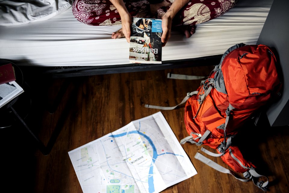 Orange And Gray Hiking Backpack On The Floor