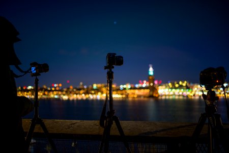 Tilt Shift Lens Photography Of Camera With Tripod photo